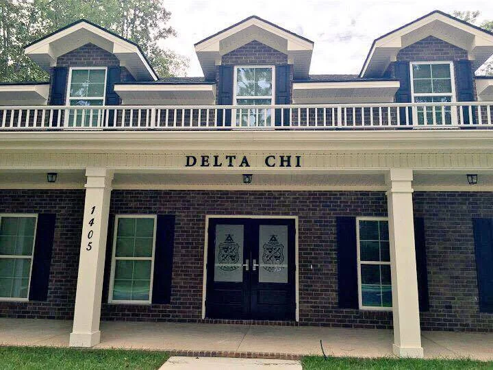 Delta Chi chapter house plaque near the porch